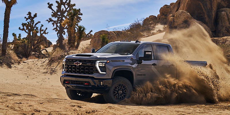 grey 2024 Silverado-HD in a desert road